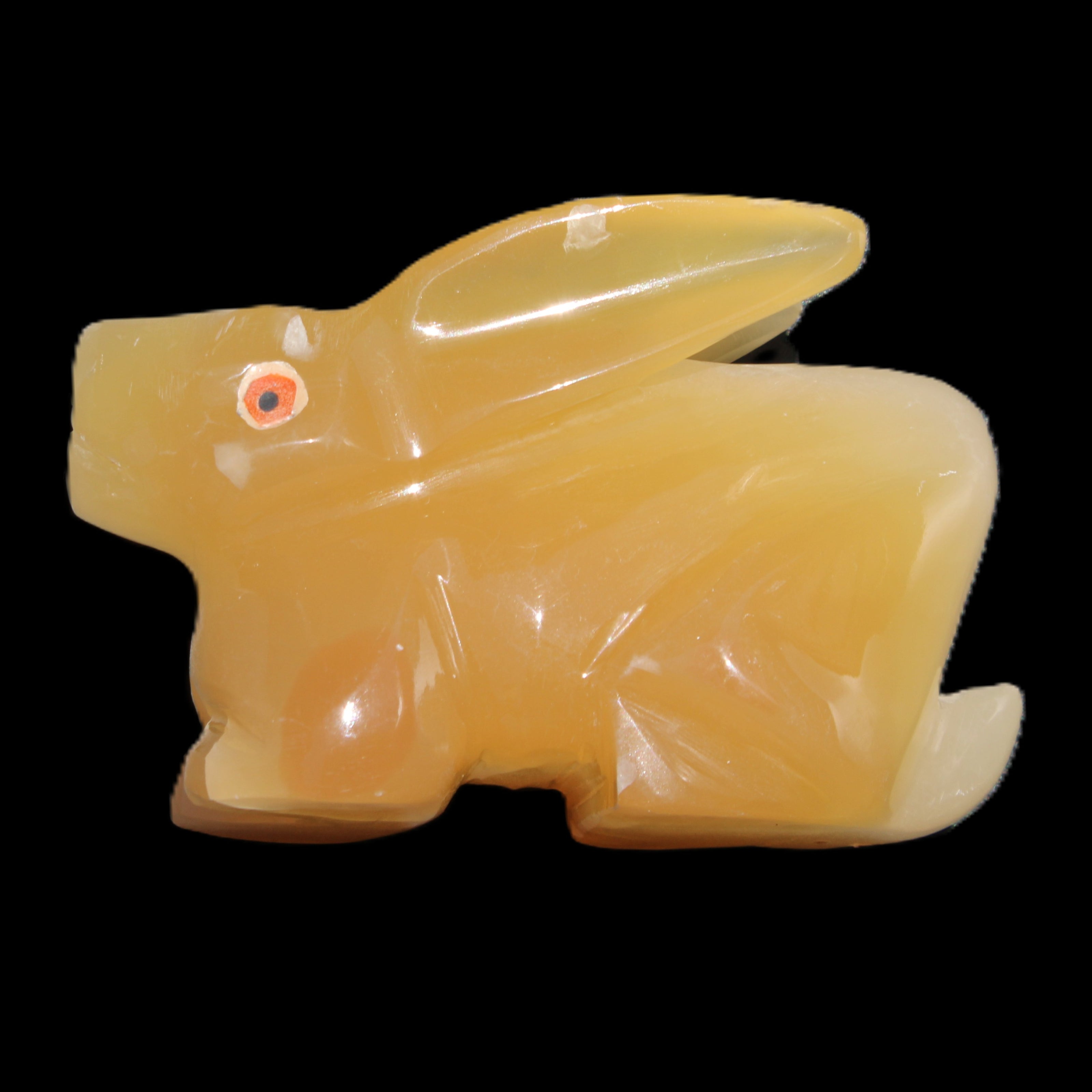Honey Calcite bunny hand-carved 102*67*52mm 477g in sunlight - Rocks and Things Store
