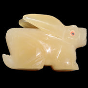 Honey Calcite bunny hand-carved 102*67*52mm 477g in sunlight - Rocks and Things Store