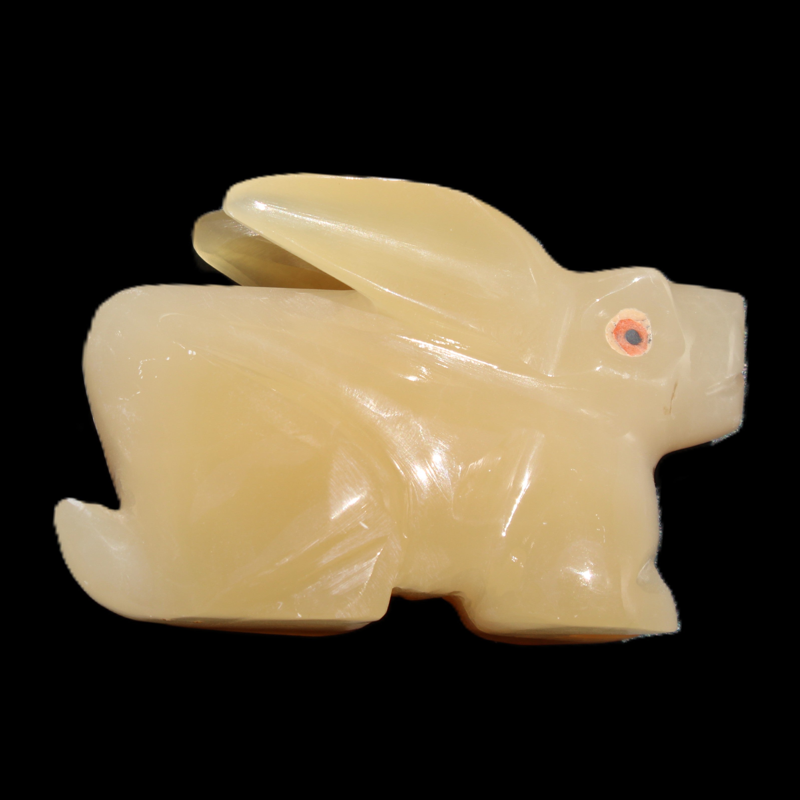 Honey Calcite bunny hand-carved 102*67*52mm 477g in sunlight - Rocks and Things Store