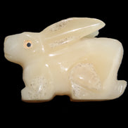 Honey Calcite bunny hand-carved 100*67*52mm 459g in sunlight - Rocks and Things Store
