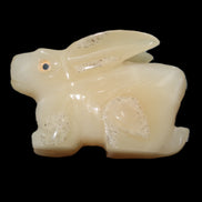 Honey Calcite bunny hand-carved 100*67*52mm 459g in sunlight - Rocks and Things Store