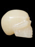 Honey Calcite skull hand-carved 60*50*39mm 192g in sunlight - Rocks and Things Store