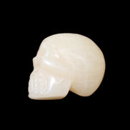 Honey Calcite skull hand-carved 60*50*39mm 192g in sunlight - Rocks and Things Store