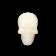 Honey Calcite skull hand-carved 60*50*39mm 192g in sunlight - Rocks and Things Store