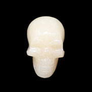 Honey Calcite skull hand-carved 60*50*39mm 192g in sunlight - Rocks and Things Store