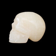 Honey Calcite skull hand-carved 60*50*39mm 192g in sunlight - Rocks and Things Store