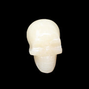 Honey Calcite skull hand-carved 60*50*39mm 192g in sunlight - Rocks and Things Store