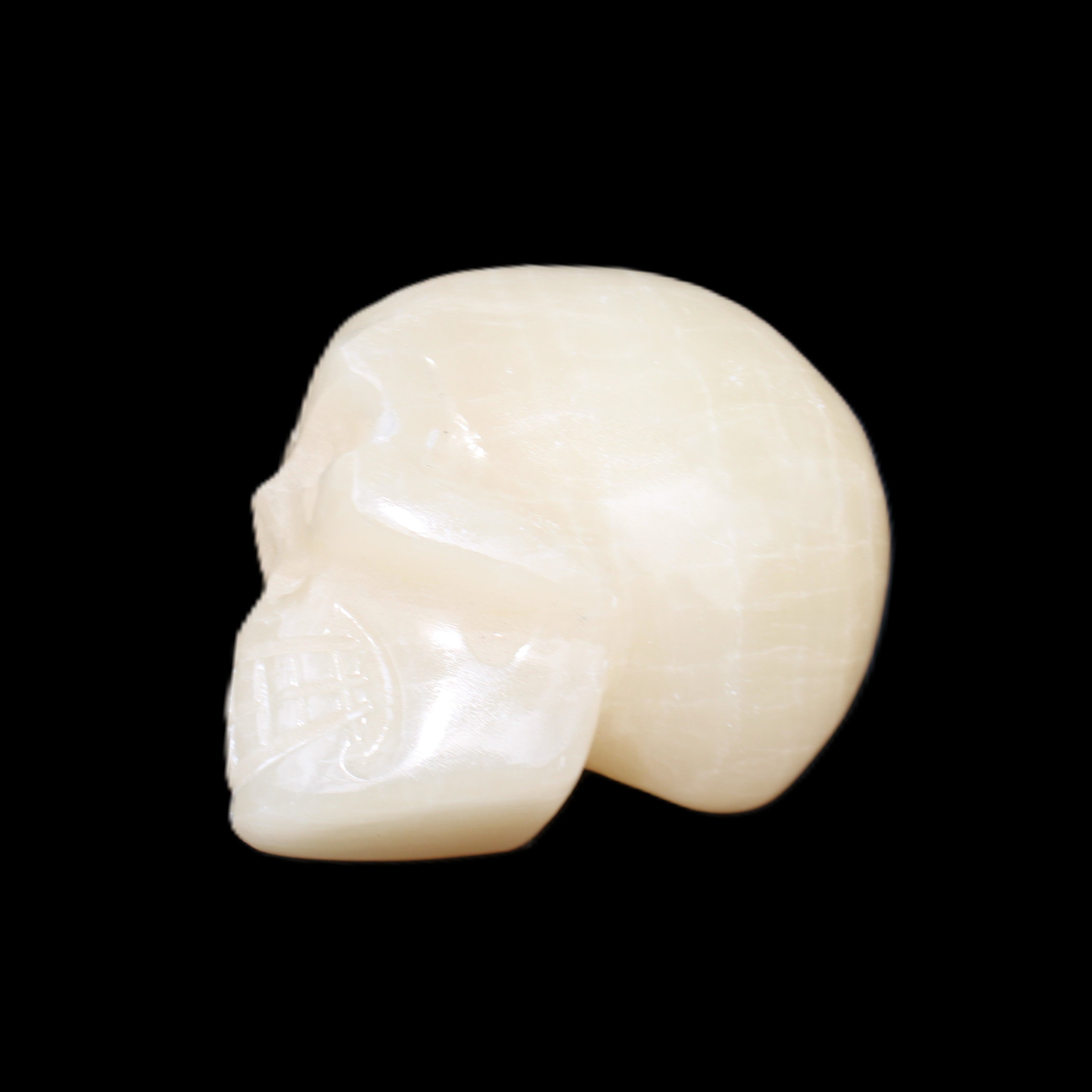 Honey Calcite skull hand-carved 60*50*39mm 192g in sunlight - Rocks and Things Store