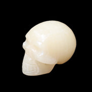 Honey Calcite skull hand-carved 60*50*39mm 192g in sunlight - Rocks and Things Store