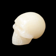 Honey Calcite skull hand-carved 60*50*39mm 192g in sunlight - Rocks and Things Store