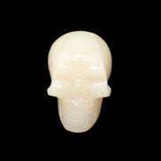 Honey Calcite skull hand-carved 60*50*39mm 192g in sunlight - Rocks and Things Store