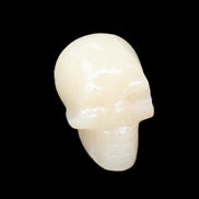 Honey Calcite skull hand-carved 60*50*39mm 192g in sunlight - Rocks and Things Store