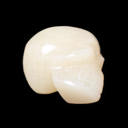 Honey Calcite skull hand-carved 60*50*39mm 192g in sunlight - Rocks and Things Store