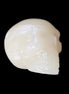 Honey Calcite skull hand-carved 58*48*40mm 175g in sunlight - Rocks and Things Store