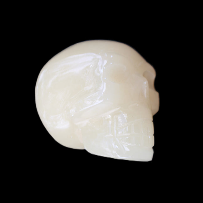 Honey Calcite skull hand-carved 58*48*40mm 175g in sunlight - Rocks and Things Store