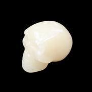 Honey Calcite skull hand-carved 58*48*40mm 175g in sunlight - Rocks and Things Store