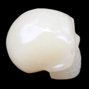 Honey Calcite skull hand-carved 58*48*40mm 175g in sunlight - Rocks and Things Store