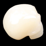 Honey Calcite skull hand-carved 58*48*40mm 175g in sunlight - Rocks and Things Store