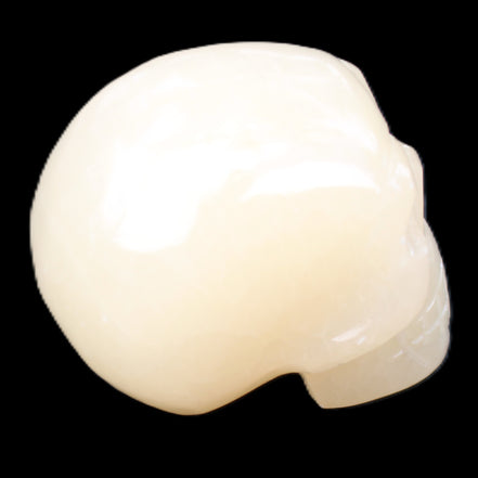 Honey Calcite skull hand-carved 58*48*40mm 175g in sunlight - Rocks and Things Store