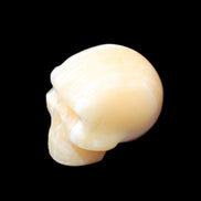 Yellow Calcite skull hand-carved 49*43*34mm 131g in sunlight - Rocks and Things Store