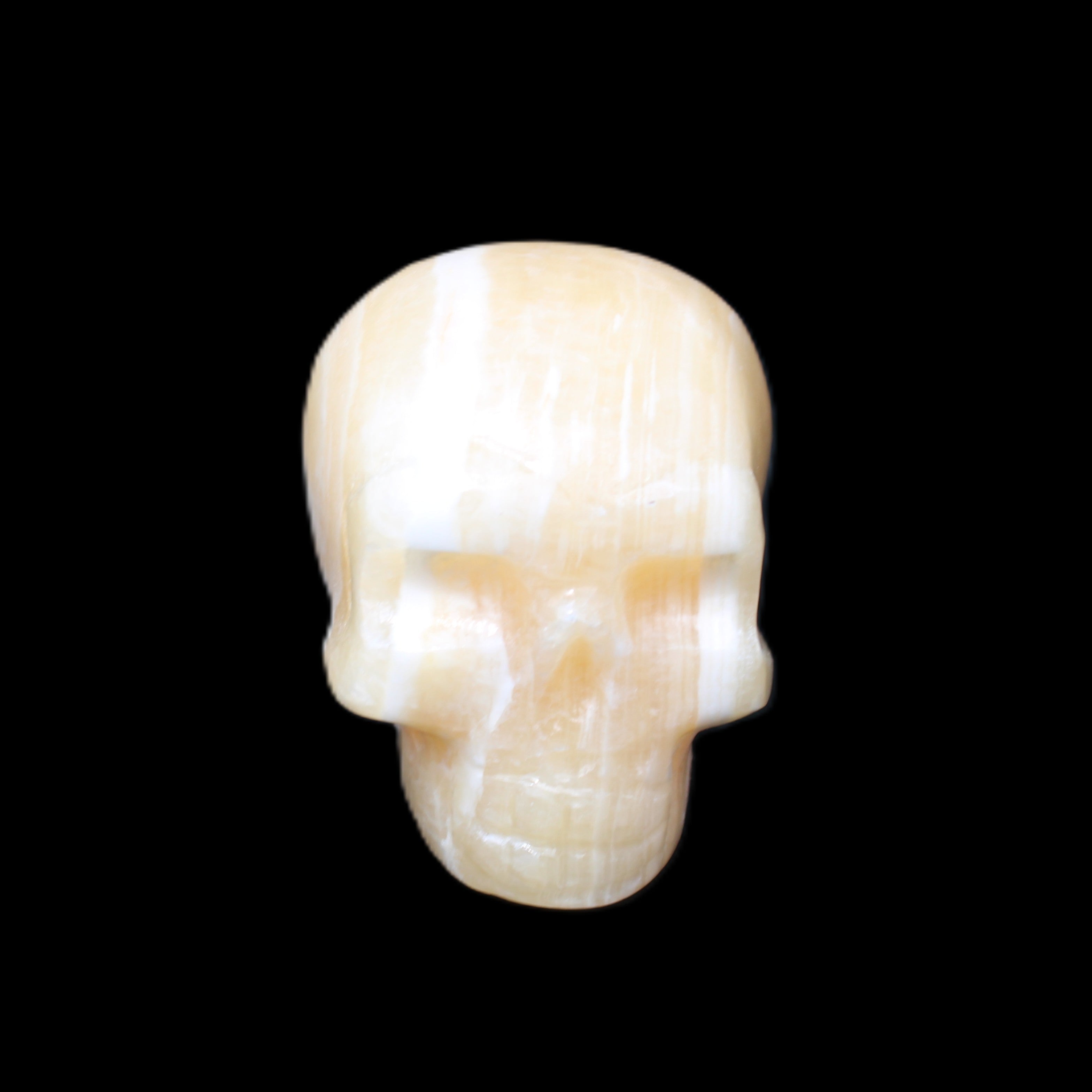 Yellow Calcite skull hand-carved 49*43*34mm 131g in sunlight - Rocks and Things Store