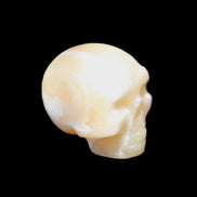 Yellow Calcite skull hand-carved 49*43*34mm 131g in sunlight - Rocks and Things Store