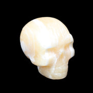 Yellow Calcite skull hand-carved 49*43*34mm 131g in sunlight - Rocks and Things Store