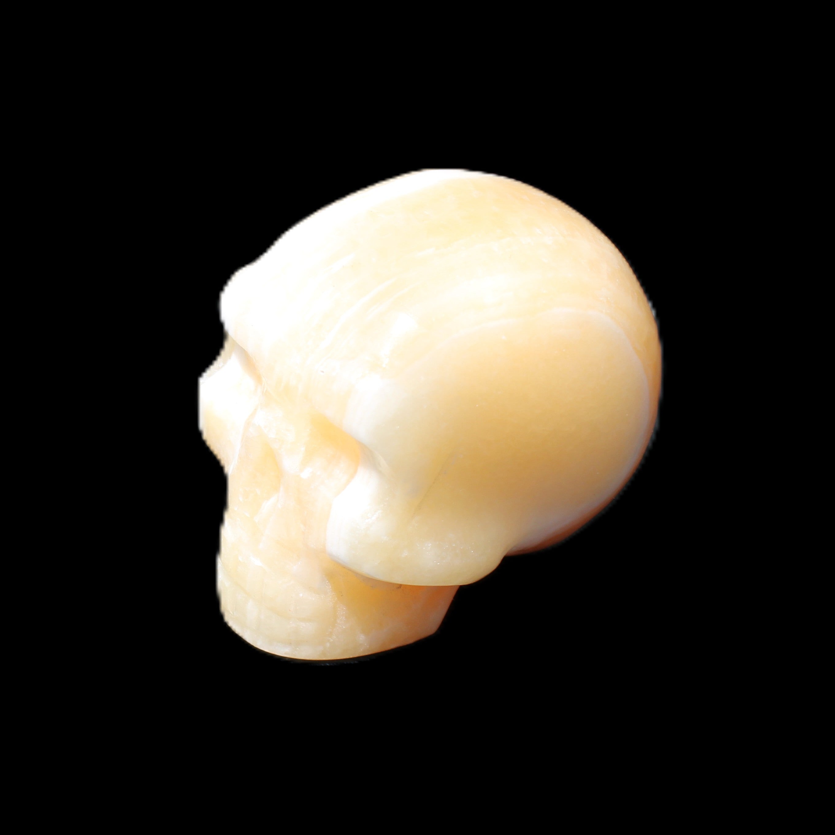 Yellow Calcite skull hand-carved 49*43*34mm 131g in sunlight - Rocks and Things Store