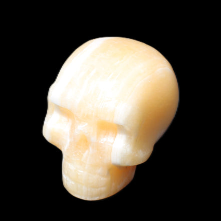 Yellow Calcite skull hand-carved 49*43*34mm 131g in sunlight - Rocks and Things Store