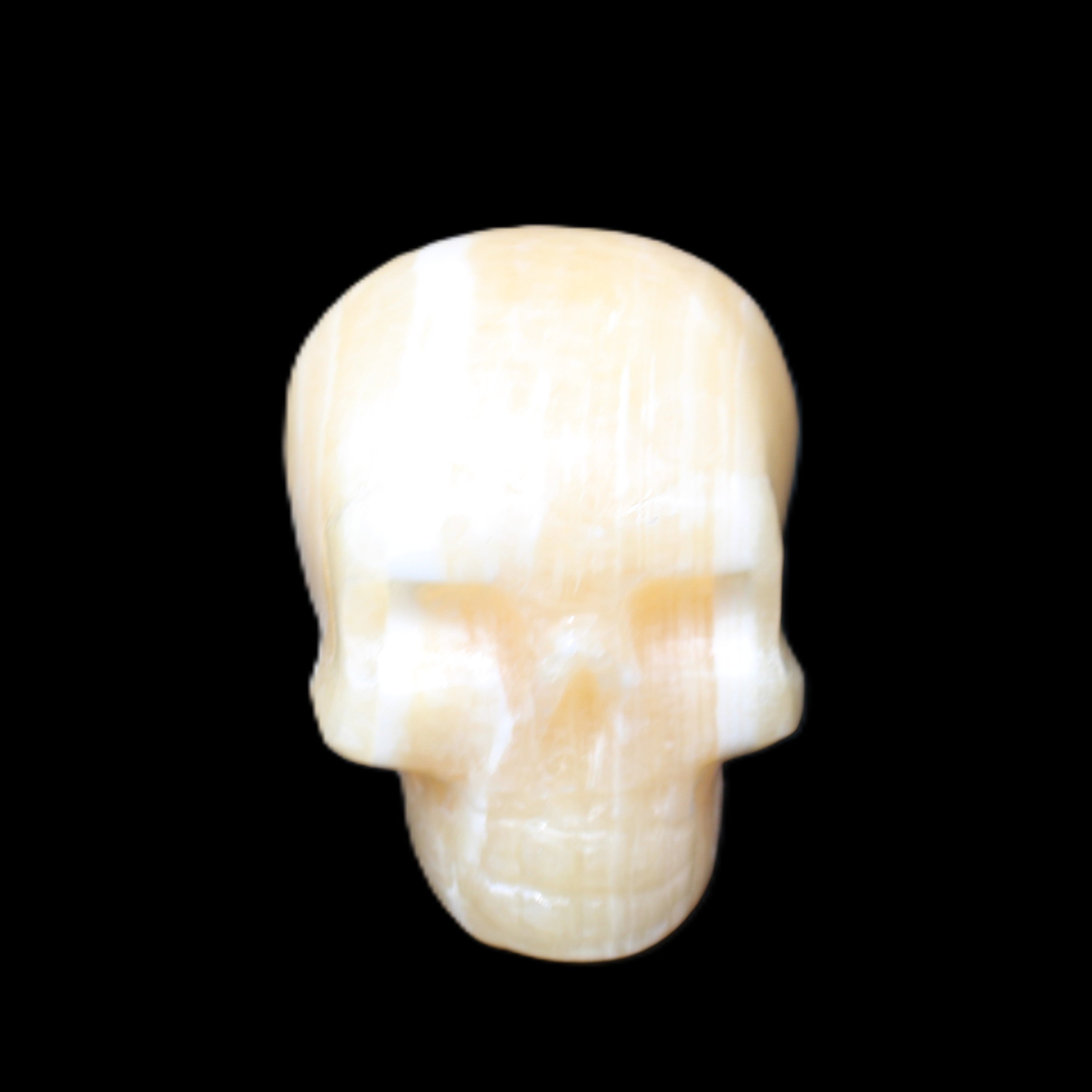 Yellow Calcite skull hand-carved 49*43*34mm 131g in sunlight - Rocks and Things Store