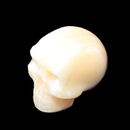 Yellow Calcite skull hand-carved 49*43*34mm 131g in sunlight - Rocks and Things Store