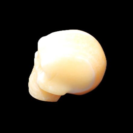 Yellow Calcite skull hand-carved 49*43*34mm 131g in sunlight - Rocks and Things Store