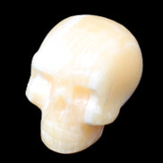 Yellow Calcite skull hand-carved 49*43*34mm 131g in sunlight - Rocks and Things Store