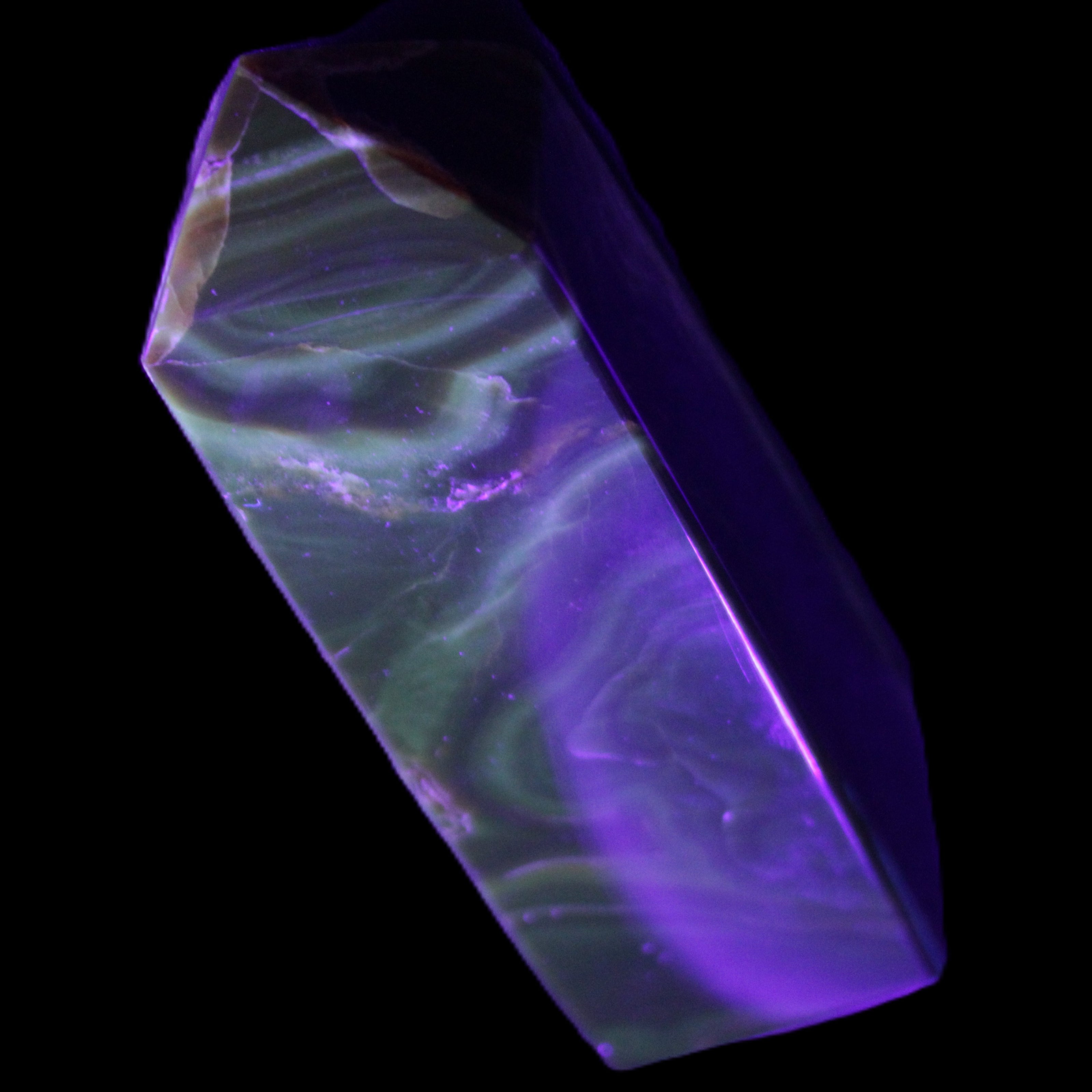 Chocolate Calcite obelisk 111*32mm 215g in UV light - Rocks and Things Store