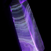 Chocolate Calcite obelisk 112*37mm 230g in UV light - Rocks and Things Store