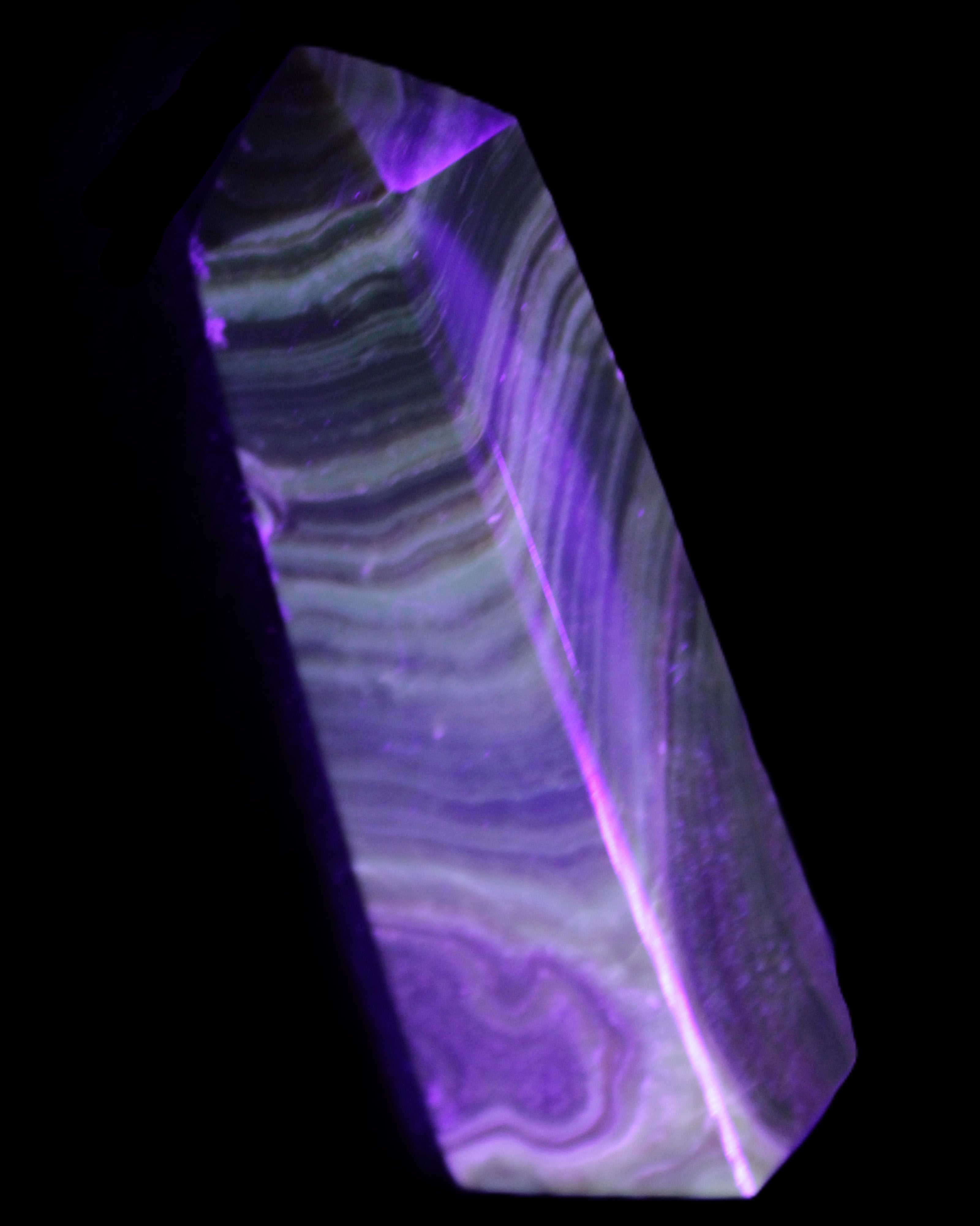 Chocolate Calcite obelisk 112*37mm 230g in UV light - Rocks and Things Store