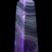 Chocolate Calcite obelisk 112*37mm 230g in UV light - Rocks and Things Store