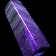 Chocolate Calcite obelisk 112*37mm 230g in UV light - Rocks and Things Store