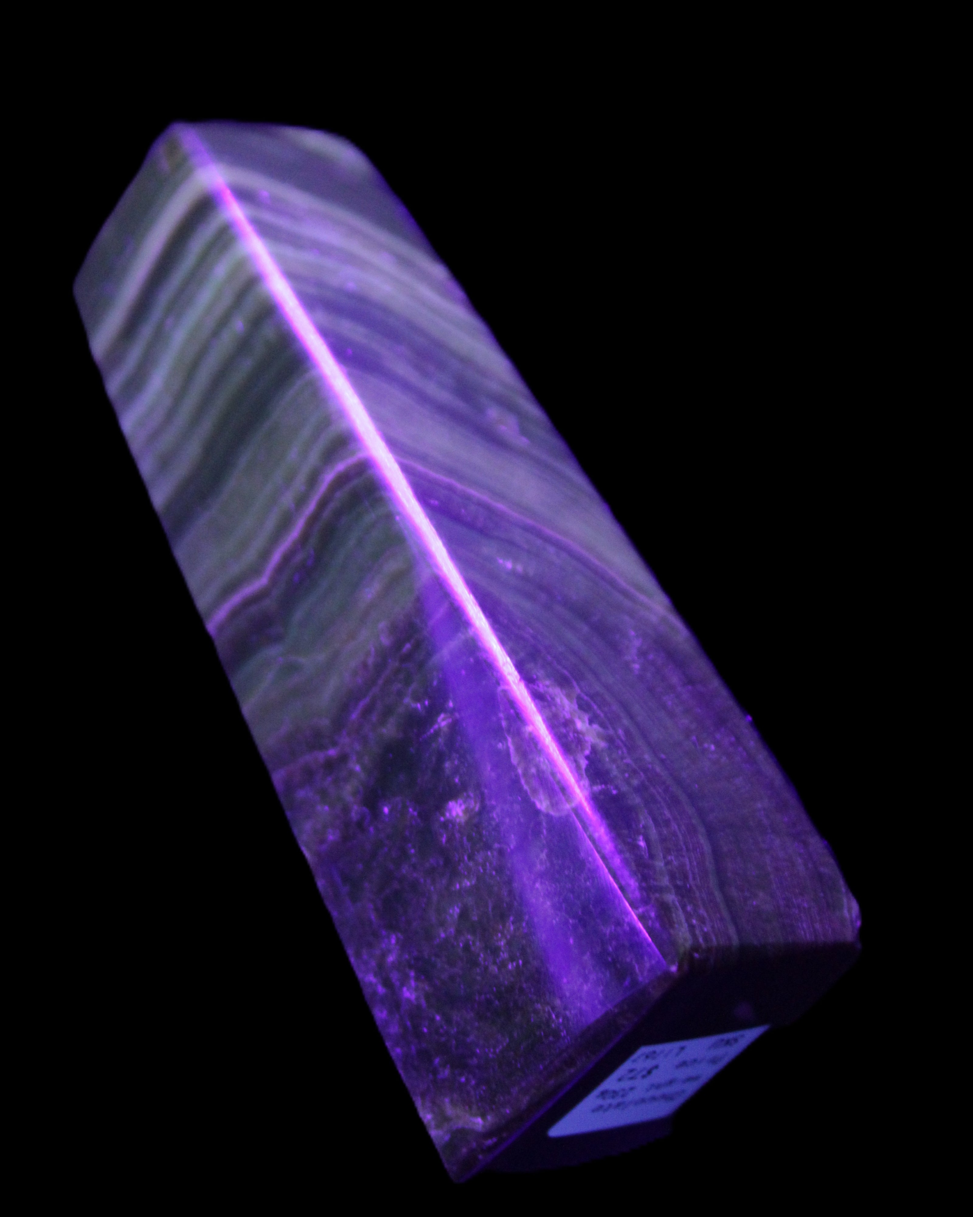 Chocolate Calcite obelisk 112*37mm 230g in UV light - Rocks and Things Store