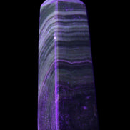 Chocolate Calcite obelisk 112*37mm 230g in UV light - Rocks and Things Store