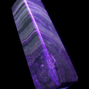 Chocolate Calcite obelisk 112*37mm 230g in UV light - Rocks and Things Store
