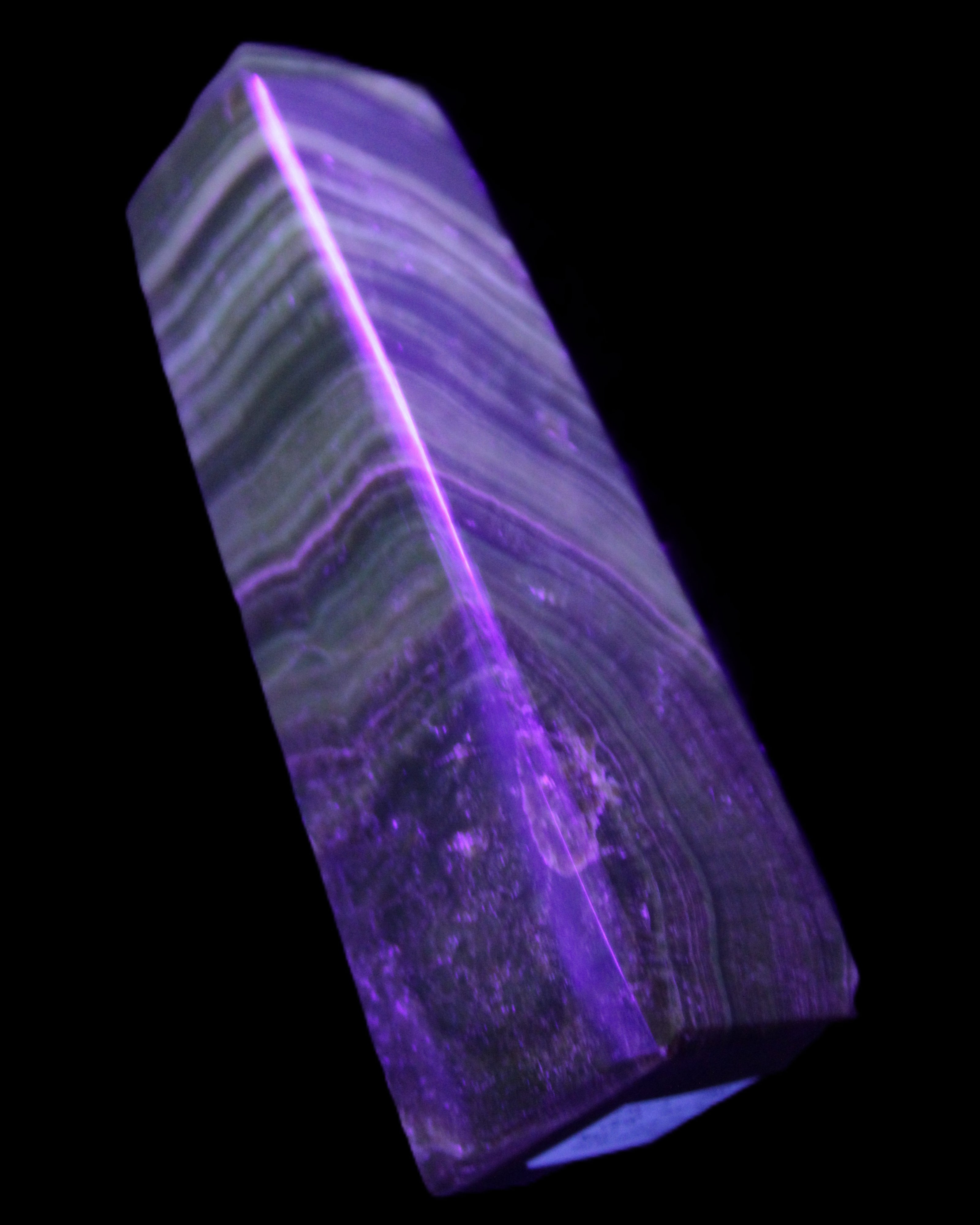 Chocolate Calcite obelisk 112*37mm 230g in UV light - Rocks and Things Store