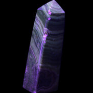 Chocolate Calcite obelisk 112*37mm 230g in UV light - Rocks and Things Store