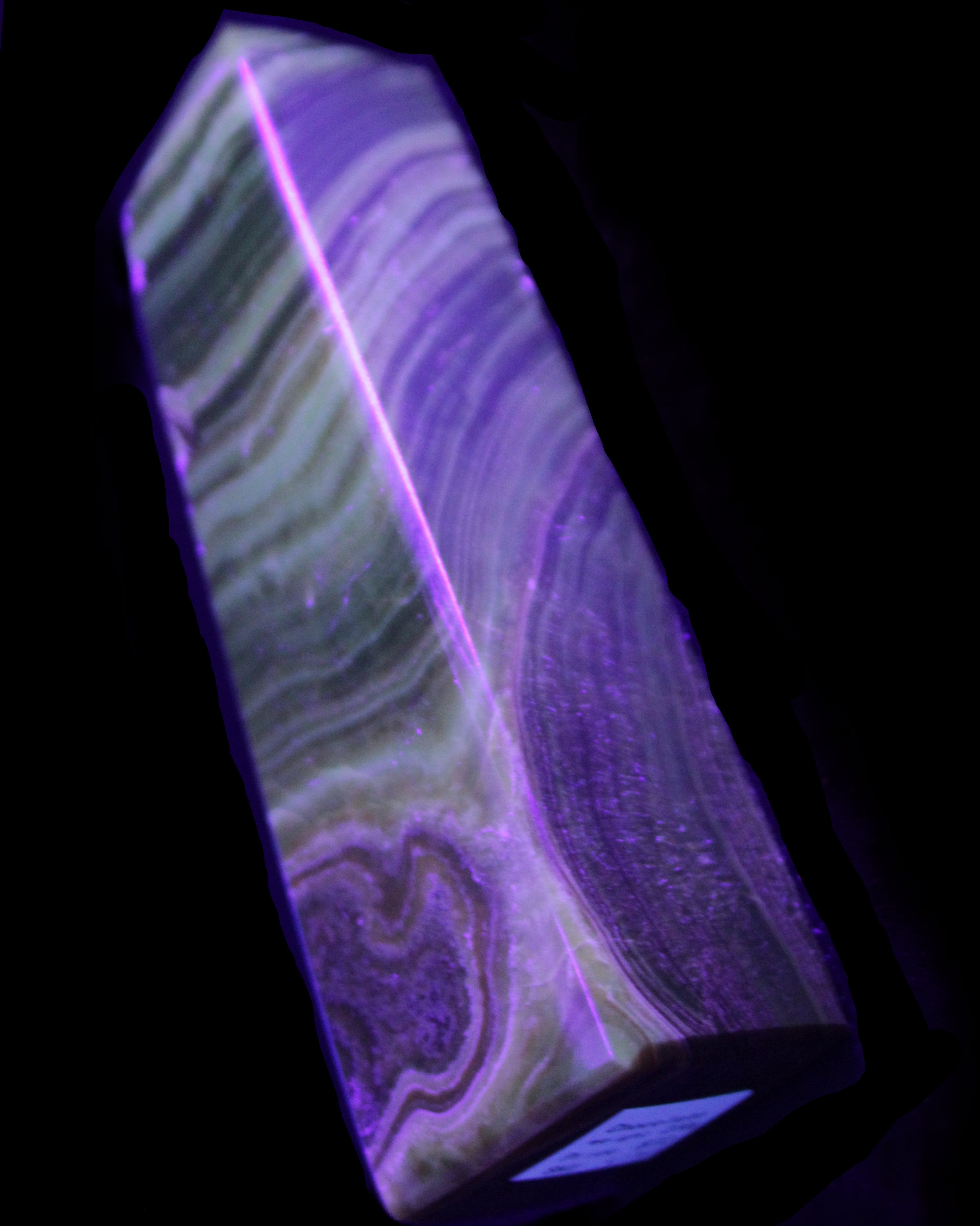 Chocolate Calcite obelisk 112*37mm 230g in UV light - Rocks and Things Store