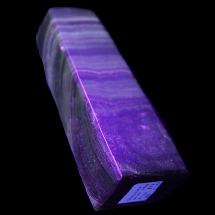 Chocolate Calcite obelisk 112*37mm 230g in UV light - Rocks and Things Store