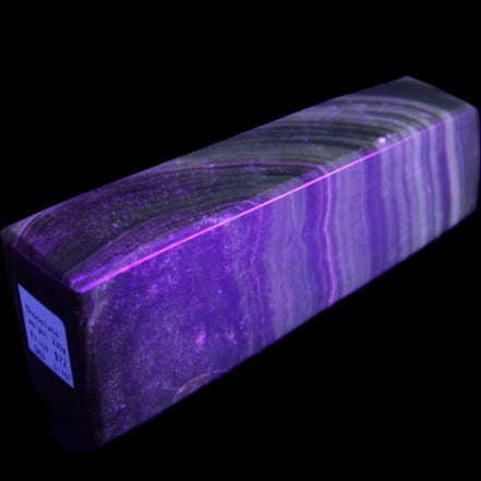 Chocolate Calcite obelisk 112*37mm 230g in UV light - Rocks and Things Store