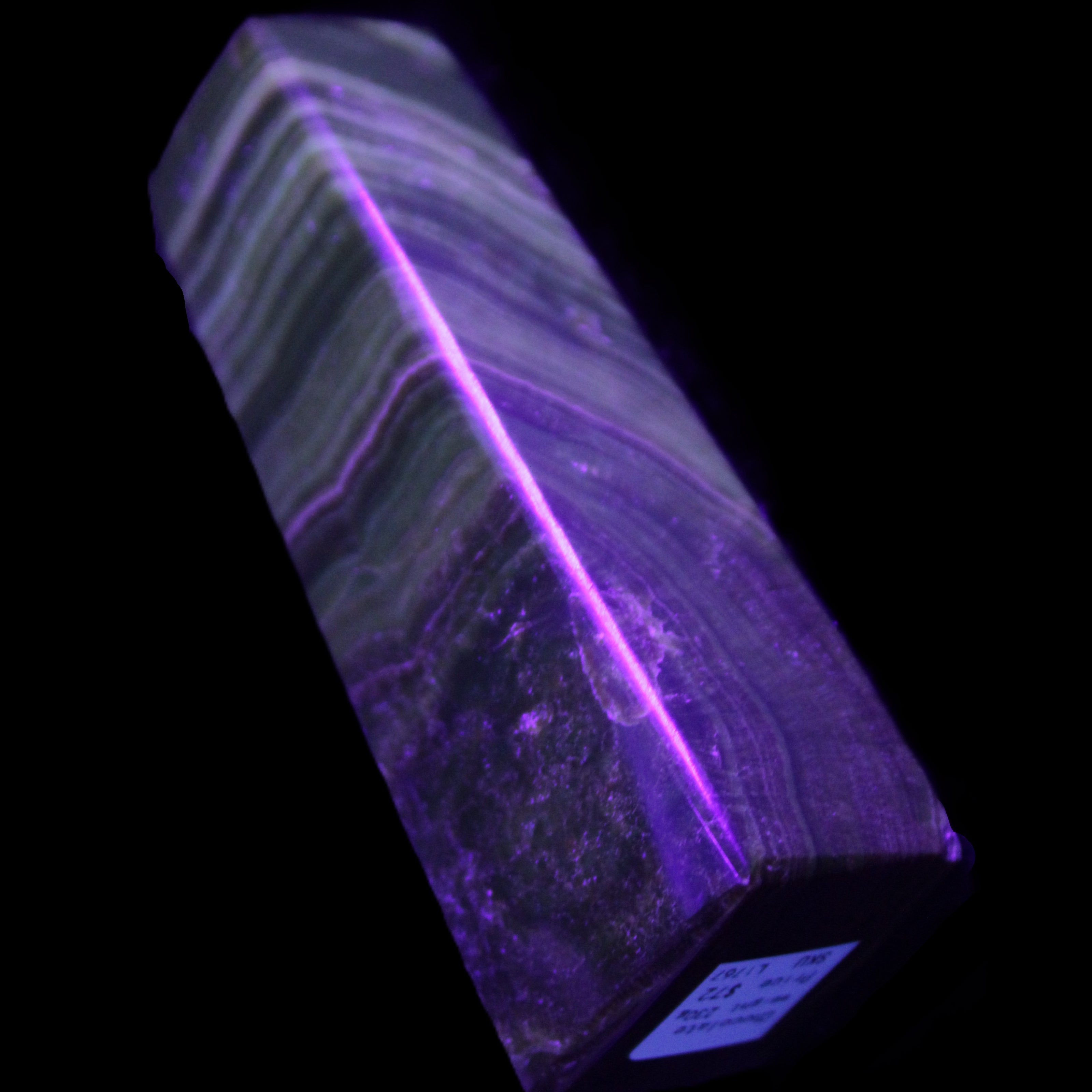Chocolate Calcite obelisk 112*37mm 230g in UV light - Rocks and Things Store