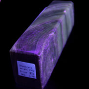 Chocolate Calcite obelisk 112*37mm 230g in UV light - Rocks and Things Store