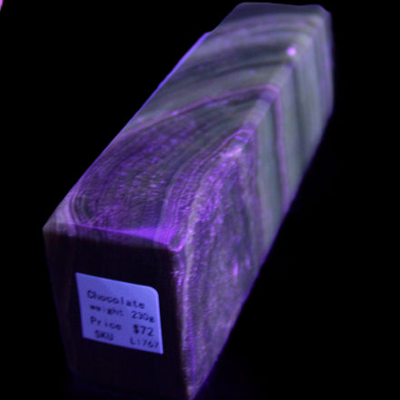 Chocolate Calcite obelisk 112*37mm 230g in UV light - Rocks and Things Store