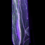 Tall Chocolate Calcite obelisk 154*32mm 439g in UV light - Rocks and Things Store